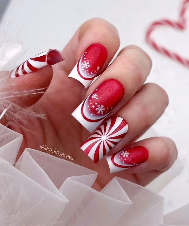 Classic red Christmas Nail designs with candy cane stripes