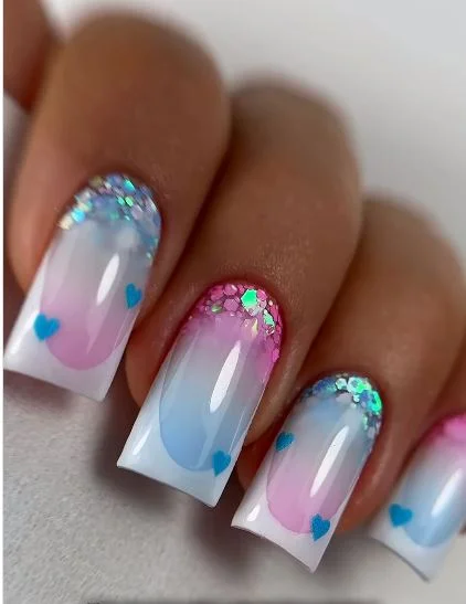 Valentine French tip nails with heart accents