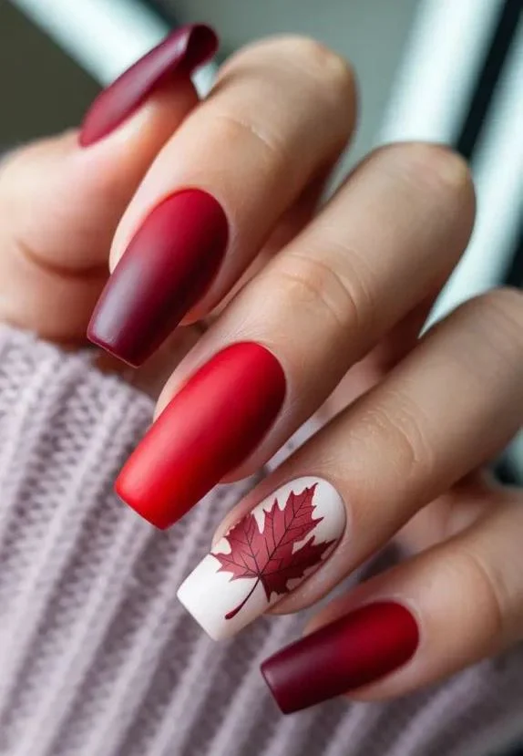 Autumn matte red manicure with leaf