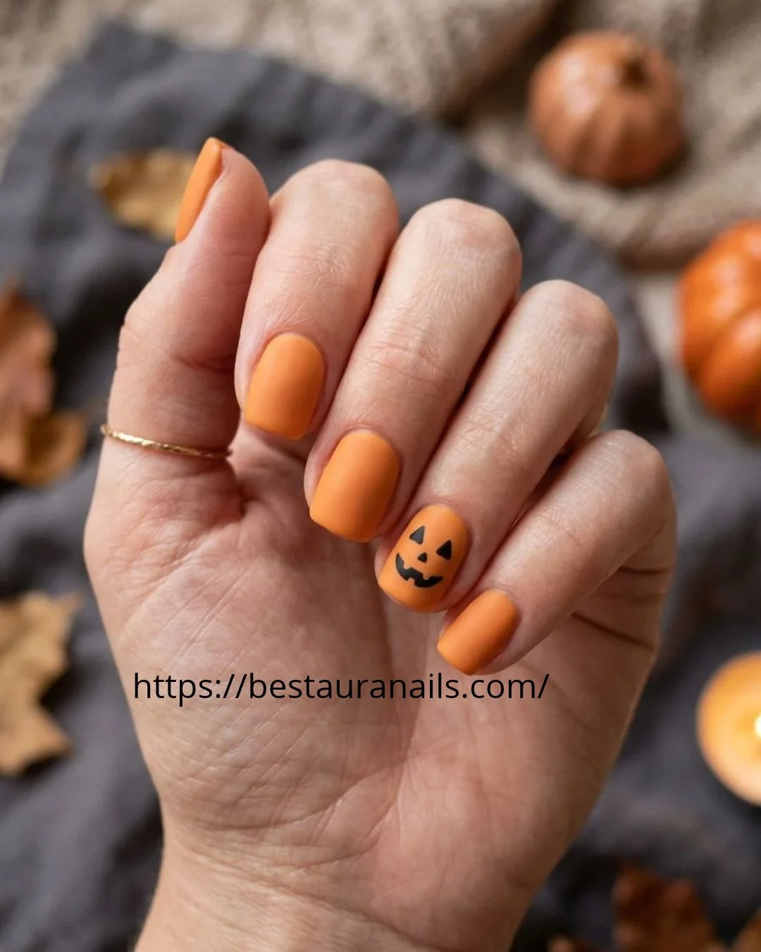 Short Halloween nails with tiny pumpkin details 