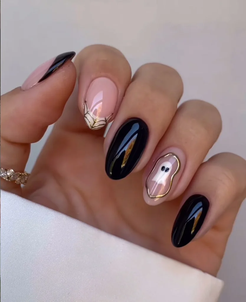 Short Halloween nails with cute ghost accents 