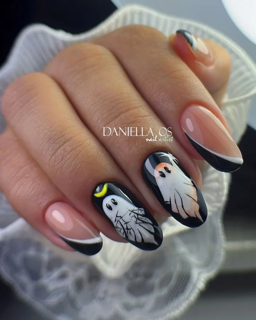 Oval Halloween nail art with ghost-shaped French tips 