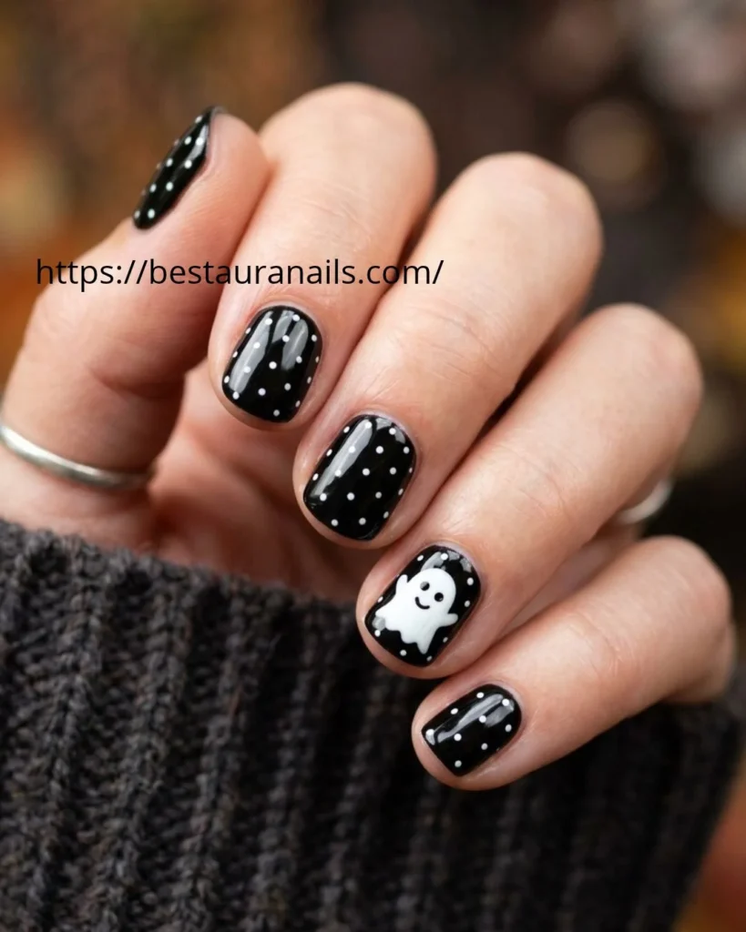 Simple short Halloween manicure with a glossy black base