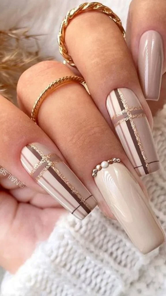 Autumn plaid nails with a fine gold accent