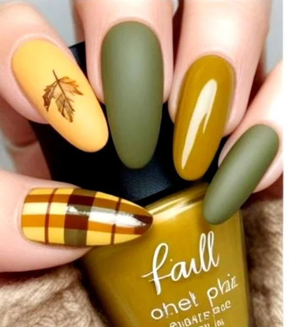 Plaid nail art with a gold maple leaf accent
